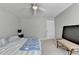 Light and airy bedroom with neutral walls, carpet, and a large window at 3285 Watson Gate Rd, Loganville, GA 30052