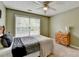 Comfortable bedroom featuring a window for natural light and a stylish wooden dresser at 3285 Watson Gate Rd, Loganville, GA 30052