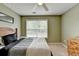 Inviting bedroom featuring carpet, a window for natural light, and a wooden dresser at 3285 Watson Gate Rd, Loganville, GA 30052