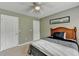 Comfortable bedroom featuring carpet, a large window, and white closet doors at 3285 Watson Gate Rd, Loganville, GA 30052