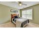 Comfortable bedroom featuring a large window for natural light and neutral carpet at 3285 Watson Gate Rd, Loganville, GA 30052