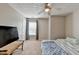 Light and airy bedroom with neutral walls, carpet, and a large window at 3285 Watson Gate Rd, Loganville, GA 30052