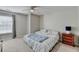 Light and airy bedroom with neutral walls, carpet, and a large window at 3285 Watson Gate Rd, Loganville, GA 30052