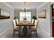Bright dining room featuring a chandelier and a large window for natural light at 3285 Watson Gate Rd, Loganville, GA 30052