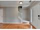 Inviting foyer with gleaming hardwood floors, staircase with carpet runner and stylish door at 3285 Watson Gate Rd, Loganville, GA 30052