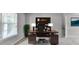 Comfortable home office features a large desk and an expansive storage system at 3285 Watson Gate Rd, Loganville, GA 30052