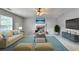 Inviting living room features a ceiling fan, fireplace, and comfortable seating area at 3285 Watson Gate Rd, Loganville, GA 30052