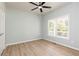 Bedroom features hardwood floors, a ceiling fan, and lots of natural light at 55 Maple Leaf Ct, Dallas, GA 30157