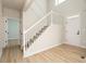 Entryway with staircase and hardwood flooring provides a welcoming entrance at 55 Maple Leaf Ct, Dallas, GA 30157