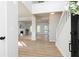 Bright, two-story foyer with hardwood floors leading to a living area and staircase at 55 Maple Leaf Ct, Dallas, GA 30157
