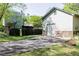 Detached garage with stone accents and a driveway, adjacent to a spacious lawn at 55 Maple Leaf Ct, Dallas, GA 30157