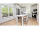 Eat-in kitchen featuring white cabinets, island seating, and stainless-steel appliances at 55 Maple Leaf Ct, Dallas, GA 30157