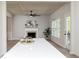 Open concept living room with coffered ceiling, fireplace, and hardwood floors at 55 Maple Leaf Ct, Dallas, GA 30157