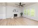 Bright living room with fireplace, large windows, and coffered ceilings at 55 Maple Leaf Ct, Dallas, GA 30157