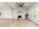Spacious living room features hardwood floors, fireplace, and large windows at 55 Maple Leaf Ct, Dallas, GA 30157