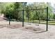 Community playground swings with green frame and a bench at 55 Maple Leaf Ct, Dallas, GA 30157