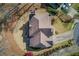 Aerial view of a house showing the roof, landscaping, and driveway at 5808 Deer Crossing Dr, Sugar Hill, GA 30518