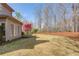 Well-maintained backyard with lush grass, trees, and manicured landscaping at 5808 Deer Crossing Dr, Sugar Hill, GA 30518