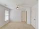 Bedroom with neutral carpet, window with blinds and a ceiling fan at 5808 Deer Crossing Dr, Sugar Hill, GA 30518