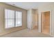 Bright bedroom with neutral carpet and trim has two closets and an en-suite bathroom for maximum convenience at 5808 Deer Crossing Dr, Sugar Hill, GA 30518