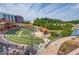 Exterior shot showcasing community amphitheater with outdoor seating, stage, and pond at 5808 Deer Crossing Dr, Sugar Hill, GA 30518