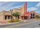 Exterior view of community theater and commercial retail building with street parking at 5808 Deer Crossing Dr, Sugar Hill, GA 30518