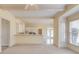 Spacious living room features beams, a sunny breakfast bar, and French doors leading to the backyard at 5808 Deer Crossing Dr, Sugar Hill, GA 30518