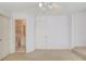 Room featuring neutral walls, neutral carpet, 2 doors and a ceiling fan at 5808 Deer Crossing Dr, Sugar Hill, GA 30518