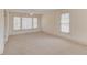 Spacious room featuring neutral walls, neutral carpet and lots of natural light at 5808 Deer Crossing Dr, Sugar Hill, GA 30518