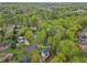 An aerial view of neighborhood, mature trees and flowering trees with lawns at 2051 Candlewood Ne Ct, Marietta, GA 30066