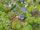 Aerial view of home, mature trees, cul-de-sac, professional landscaping and flowering trees at 2051 Candlewood Ne Ct, Marietta, GA 30066
