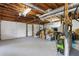 Unfinished basement provides ample room for storage, featuring convenient access to garage with natural sunlight at 2051 Candlewood Ne Ct, Marietta, GA 30066