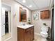 Basement bathroom featuring a vanity, commode and walk-in closet at 2051 Candlewood Ne Ct, Marietta, GA 30066