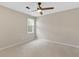 Neutral bedroom with a ceiling fan, light carpet, and natural light from the window at 2051 Candlewood Ne Ct, Marietta, GA 30066