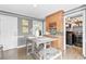 The eat-in kitchen features a built-in bar with wine rack and additional storage with table and barstool seating at 2051 Candlewood Ne Ct, Marietta, GA 30066