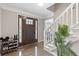 Foyer with wood floors, staircase, and a traditional-style front door with decorative side windows at 2051 Candlewood Ne Ct, Marietta, GA 30066
