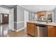Modern kitchen featuring a stainless-steel dishwasher and breakfast bar area at 2051 Candlewood Ne Ct, Marietta, GA 30066