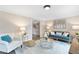 Inviting living room featuring comfortable seating, a center table, and a stylish decor with a bright and airy atmosphere at 2051 Candlewood Ne Ct, Marietta, GA 30066