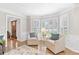 Inviting living room features a bay window, a wood floor, and a front door entrance view at 2051 Candlewood Ne Ct, Marietta, GA 30066