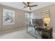 Bright office with multiple windows, a desk setup, and a view to the outside at 2051 Candlewood Ne Ct, Marietta, GA 30066