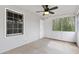Unfurnished screened-in porch with ceiling fan provides a wonderful view of the wooded landscape and natural sunlight at 2051 Candlewood Ne Ct, Marietta, GA 30066