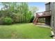 The house features a large, well-maintained lawn and deck at 4015 Brookhollow Dr, Douglasville, GA 30135
