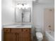 Bathroom with a single sink vanity, large mirror, tub and shower at 4015 Brookhollow Dr, Douglasville, GA 30135