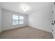 Bedroom features neutral walls, one window, and carpet flooring at 4015 Brookhollow Dr, Douglasville, GA 30135