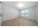 Bedroom features neutral walls, one window, and carpet flooring at 4015 Brookhollow Dr, Douglasville, GA 30135