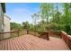 Wooden deck with railings overlooking a lush green backyard at 4015 Brookhollow Dr, Douglasville, GA 30135