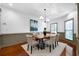 The dining room has wood floors, modern lighting, and is open to the main living space at 4015 Brookhollow Dr, Douglasville, GA 30135