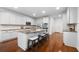 Bright kitchen featuring a center island with granite countertops, stainless steel appliances, and white cabinets at 4015 Brookhollow Dr, Douglasville, GA 30135