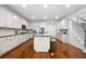 Modern kitchen with white cabinets, granite countertops, stainless steel appliances, and a kitchen island at 4015 Brookhollow Dr, Douglasville, GA 30135