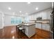 Bright kitchen features a center island, stainless steel appliances, and hardwood floors at 4015 Brookhollow Dr, Douglasville, GA 30135